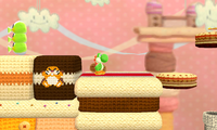A Poochy & Yoshi's Woolly World screenshot of a Monty Mole Patch in Yoshi and Cookies