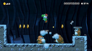 Super Mario Maker screenshot of a New Super Mario Bros. U-style custom level of Yoshi defeating big Monty Moles while a big Rocky Wrench throws a wrench at him